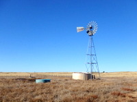 GDMBR: A working windmill, a water tank, and a way to get water.